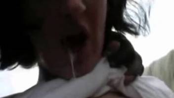 Aroused dark-haired woman engages in animalistic trio with a stallion